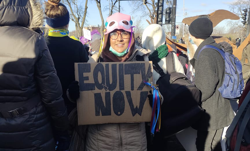 Maryam Eqam at a climate march demanding "equity now".